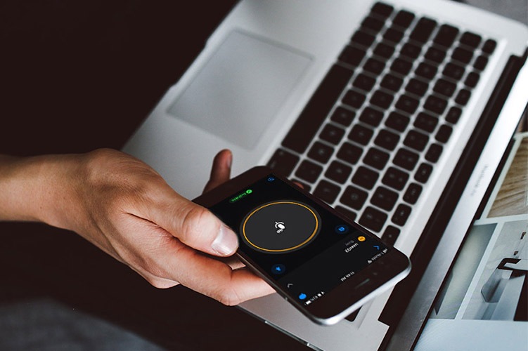 Zello talk screen on smart phone in front of a laptop
